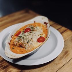 Pizzeria Trattoria Italiana - Canelón relleno de pollo y espinaca en salsa rosada gratinado con mozzarella