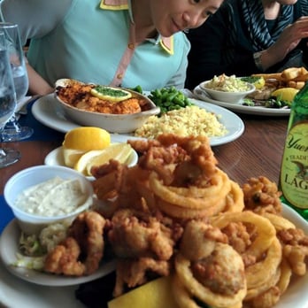 Schooner's Restaurant - Fried clams in front and baked scallops in the back, plus my curious stare into the broiled swordfish - Seafood Near Me - Hull, Massachusetts Schooner's Restaurant - Fried clams in front and baked scallops in the back, plus my curious stare into the broiled swordfish - Seafood Near Me - Hull, Massachusetts