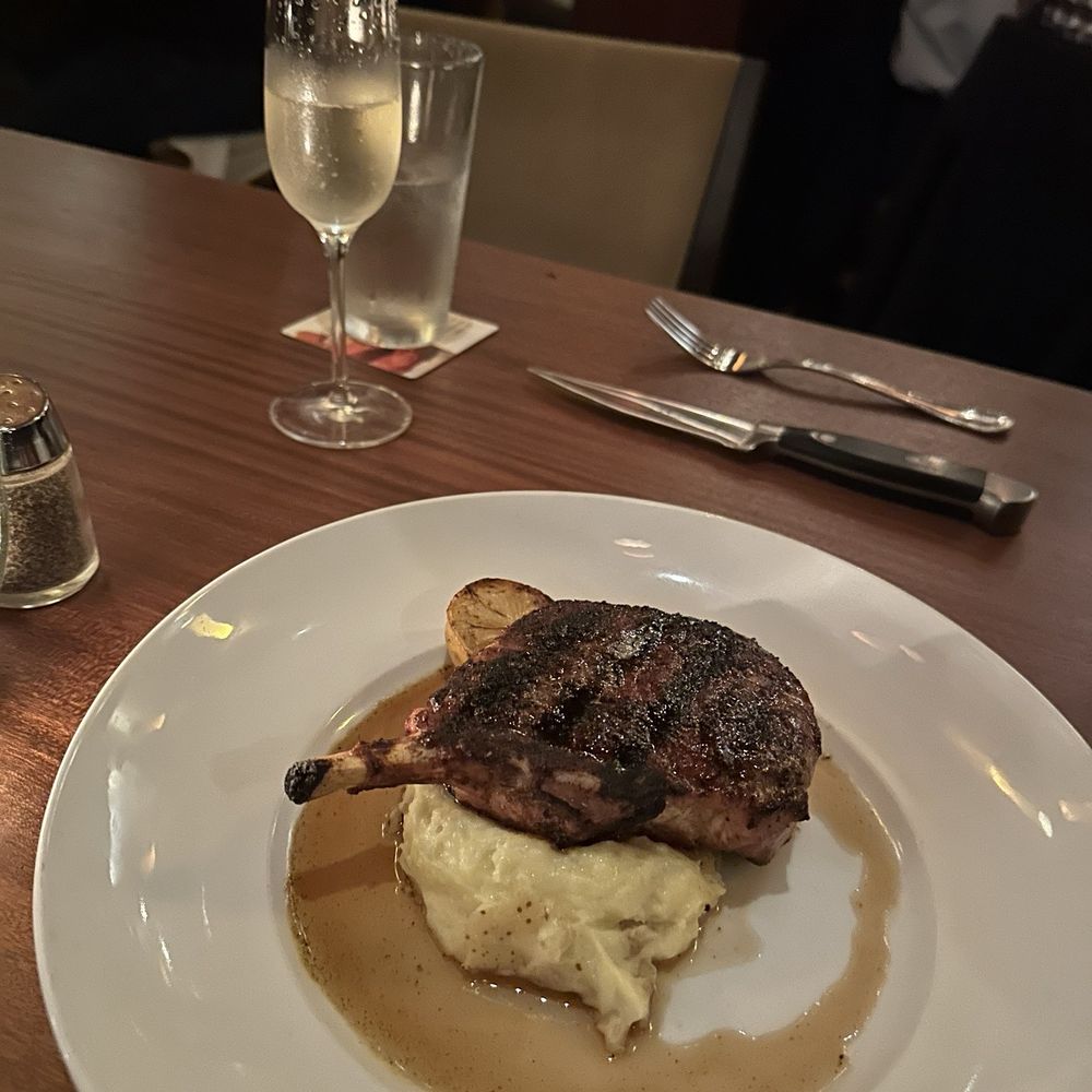 Seasons 52 - Wood-Grilled Dry-Rubbed Pork Chop - New American Near Me - Schaumburg, Illinois Seasons 52 - Wood-Grilled Dry-Rubbed Pork Chop - New American Near Me - Schaumburg, Illinois