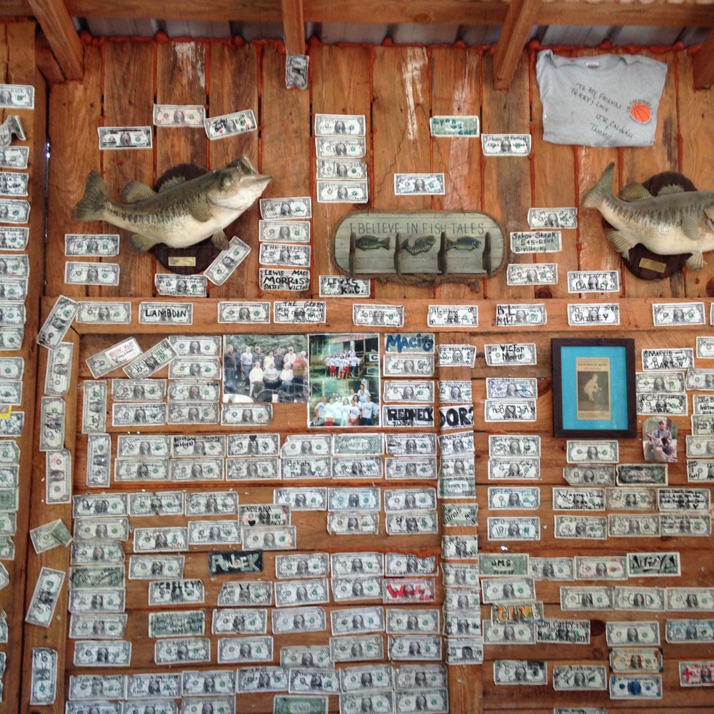 Heavy's BBQ - Dollar bills decorate the walls. - Barbeque Near Me - Harrogate, Tennessee