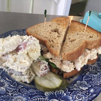 The Porch - a sandwich and potato salad on a plate - American Near Me - Springfield Center, New York