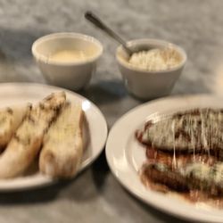 Sugo Italian Restaurant - Eggplant Parmesan substituted angel hair for polenta add a side of Alfredo and dip some, pour some and take the remainder home.