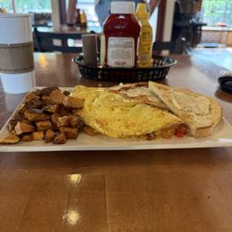 Veggie omelet, home fries and toast. Veggie omelet, home fries and toast.