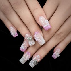 Pure Nails Spa - Soft pink, tiny flowers, and a little sparkle A sweet set made to stand out in the prettiest way.