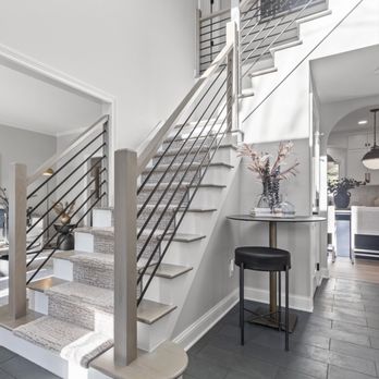 Casino - A full home remodel included a grand entryway with redesigned staircase. - General Contractors Near Me - Grove City, Ohio