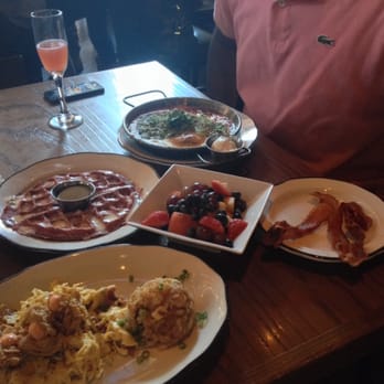 Tavern - The nooner, red velvet waffle, huervos rancheros, a side of fruit and bacon. Perfection - New American Near Me - Nashville, Tennessee