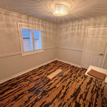 Delvin Homes - empty room with wood floor - Painters Near Me Delvin Homes - empty room with wood floor - Painters Near Me