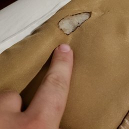 Cigarette burn on blanket. Cigarette burn on blanket.