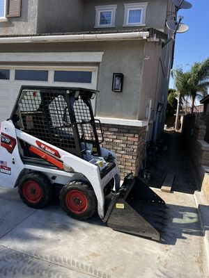 Bobcat Mini Skid Steer Rental - Heavy Debris ? No problem. Our skid steer makes clearing concrete and soil fast & safe