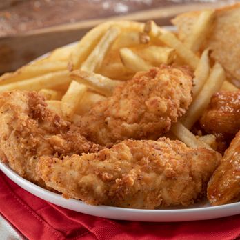 Slim Chickens - a plate of fried chicken and french fries - Chicken Wings Near Me - Levelland, Texas Slim Chickens - a plate of fried chicken and french fries - Chicken Wings Near Me - Levelland, Texas