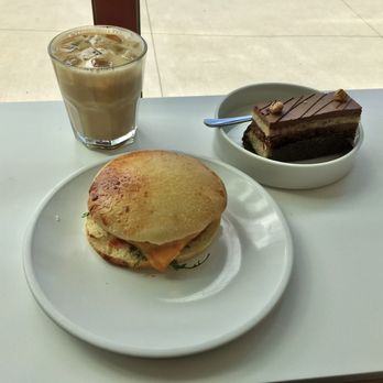 To Live For Bakery - English Muffin Breakfast Sandwich with Sausage + Hazelnut Mousse Cake + Cherry Blossom Latte - Bakeries Near Me - Vancouver, British Columbia To Live For Bakery - English Muffin Breakfast Sandwich with Sausage + Hazelnut Mousse Cake + Cherry Blossom Latte - Bakeries Near Me - Vancouver, British Columbia