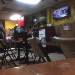 Alfeshawy Cafe - Interior of the shisha/hookah bar from the outside shelter. Seems to be a simple, laid back bar, with a friendly owner. (11/24/2017)