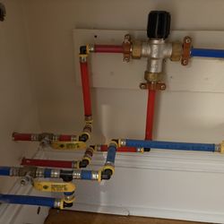 The Plumber Daniel - Remotely mounted thermostatic hot water mixing valve for free standing bathtub in a remodel project.