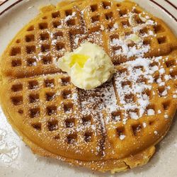 Uncle Bill's Pancake House - Golden Brown Waffle with butter and powder sugar.