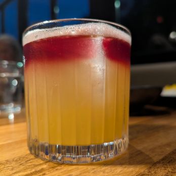Yalda - Atlanta - Hafez's Last Word cocktail. $14. Capel Pisco, amaro, lime, passion fruit, orgeat, red wine float. - Middle Eastern Near Me - Atlanta, Georgia
