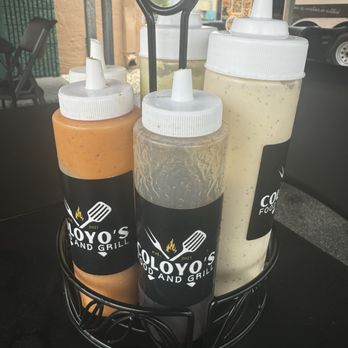 Coloyos Food And Grill - Their homemade sauces! My favorite was the one in the front. It's a pineapple with cinnamon sauce that's sweet but not overpowering! - Food Trucks Near Me - Miami, Florida Coloyos Food And Grill - Their homemade sauces! My favorite was the one in the front. It's a pineapple with cinnamon sauce that's sweet but not overpowering! - Food Trucks Near Me - Miami, Florida