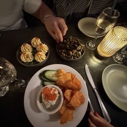 Caviar and chips, deviled eggs, crispy brussel sprouts. Caviar and chips, deviled eggs, crispy brussel sprouts.