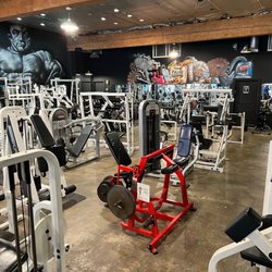 Foster Fitness Center - Strength machines, free weights & squat racks on the back wall