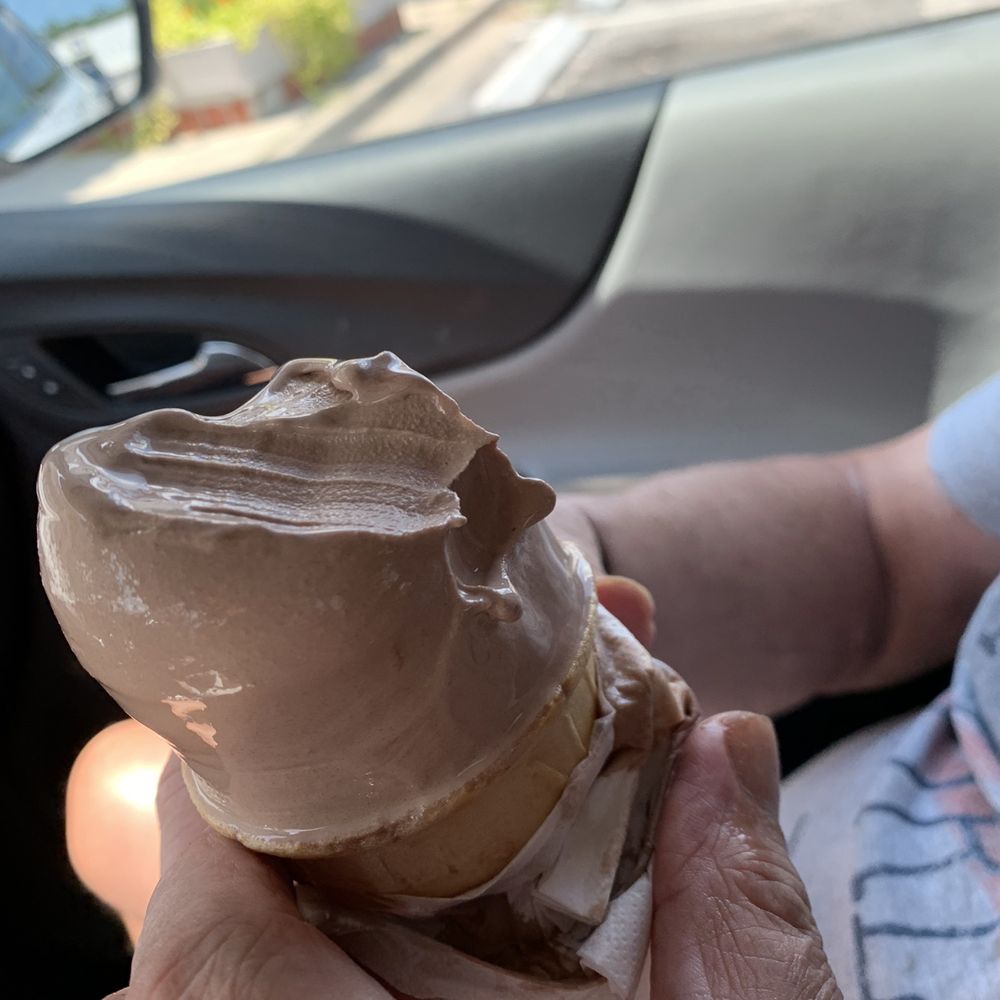 Regular-sized soft serve chocolate ice cream cone. Regular-sized soft serve chocolate ice cream cone.