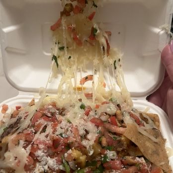 Hugo's Tacos - Nachos with all the cheese melted into the box. - Food Stands Near Me - Atwater Village, California