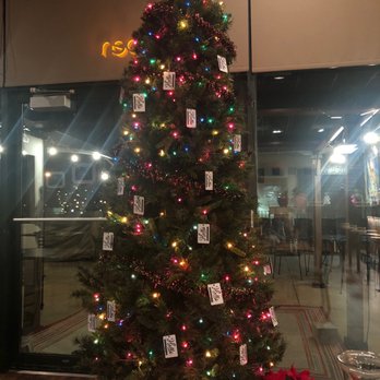 Holla - a decorated christmas tree in a restaurant - New American Near Me - Manitowoc, Wisconsin