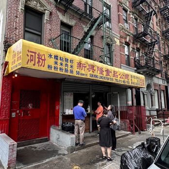 Sun Hing Lung - a group of people standing in front of a building - Chinese Near Me - New York, New York Sun Hing Lung - a group of people standing in front of a building - Chinese Near Me - New York, New York