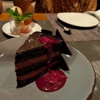 Saffron NOLA - Yummy chocolate cake with the very very faintest hint of cardamom that gave it a nice twist - Indian Near Me - New Orleans, Louisiana Saffron NOLA - Yummy chocolate cake with the very very faintest hint of cardamom that gave it a nice twist - Indian Near Me - New Orleans, Louisiana