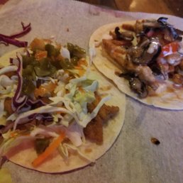 Fish taco on the left and philly taco on right. Fish taco on the left and philly taco on right.