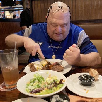 LongHorn Steakhouse - This is my husband digging into his Renegade Steak, he was very happy with his dinner - Steakhouses Near Me - Fairview Heights, Illinois