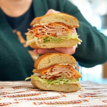 Firehouse Subs - a person holding a sandwich - Fast Food Near Me - Greenville, North Carolina Firehouse Subs - a person holding a sandwich - Fast Food Near Me - Greenville, North Carolina
