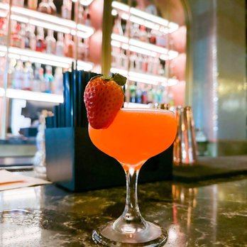 Bellhop - a drink with a strawberry on the rim - Cocktail Bars Near Me - Orlando, Florida Bellhop - a drink with a strawberry on the rim - Cocktail Bars Near Me - Orlando, Florida