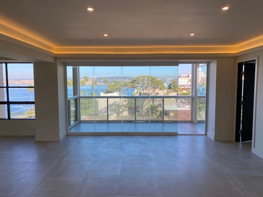 La Jolla Oceanfront Condo - Condo Remodel in beautiful La Jolla, CA. 2 traditional sliding doors were removed and we installed 2 of our Frameless Sliding Glass Door systems. Our lower track is fully flush with the finished floor so there is nothing to step or trip over. The customer wanted to be able to take advantage of their views and Welcome The Outside In™. La Jolla Oceanfront Condo - Condo Remodel in beautiful La Jolla, CA. 2 traditional sliding doors were removed and we installed 2 of our Frameless Sliding Glass Door systems. Our lower track is fully flush with the finished floor so there is nothing to step or trip over. The customer wanted to be able to take advantage of their views and Welcome The Outside In™.