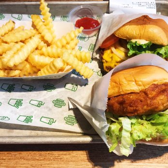 Shake Shack El Segundo - Front - chicken burger - the chicken is very dry.  Back - classic shack burger - Burgers Near Me - El Segundo, California