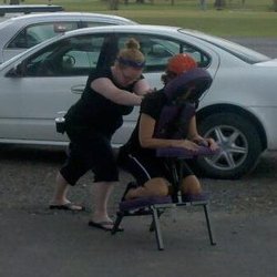Wellness by Wellman - Doing Chair massages at a Charity Golf Tournament for a local children's home.