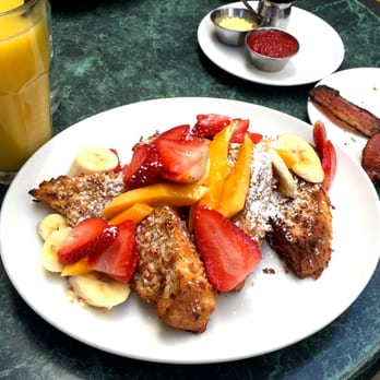 Plums Cafe - Coconut French Toast with papaya, bananas, and strawberries. Bacon on the side is extra. - Breakfast & Brunch Near Me - Costa Mesa, California