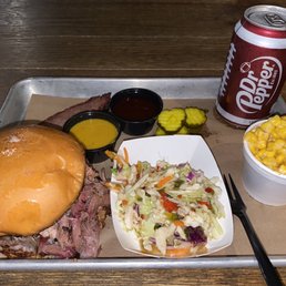 Pulled pork sandwich (slaw, pickles, and sauce on the side), Cheesy Corn, a taste of brisket, can of Dr Pepper.