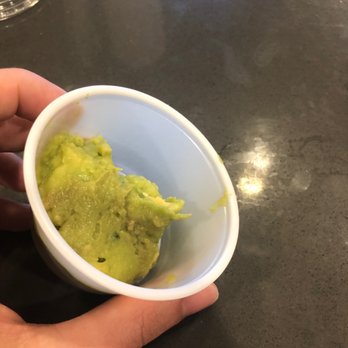 Freebirds World Burrito - a hand holding a bowl of guacamole - Tex-Mex Near Me - Fort Worth, Texas Freebirds World Burrito - a hand holding a bowl of guacamole - Tex-Mex Near Me - Fort Worth, Texas