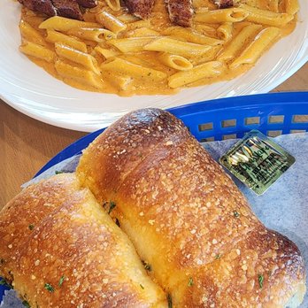 Nonna’s Pizza & Pasta - Penne pasta with crispy chicken, and it's served with dinner rolls - Pizza Near Me - Ankeny, Iowa Nonna’s Pizza & Pasta - Penne pasta with crispy chicken, and it's served with dinner rolls - Pizza Near Me - Ankeny, Iowa