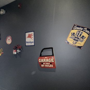 C-Crab - a wall with a variety of signs on it - Cajun/Creole Near Me - Camp Springs, Maryland