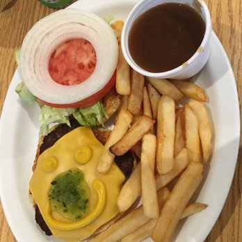 Village Cafe - a burger and french fries on a plate - Canadian (New) Near Me - Ohsweken, Ontario