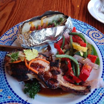 Stage Coach Grille - Grilled pork chop with loaded baked potato and grilled veggies. - Seafood Near Me - La Verkin, Utah Stage Coach Grille - Grilled pork chop with loaded baked potato and grilled veggies. - Seafood Near Me - La Verkin, Utah
