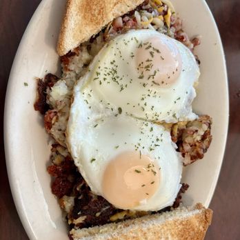 Debs Country Cafe - Corned beef hash skillet with basted eggs and white toast - Breakfast & Brunch Near Me - Darien, Wisconsin Debs Country Cafe - Corned beef hash skillet with basted eggs and white toast - Breakfast & Brunch Near Me - Darien, Wisconsin