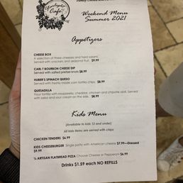 a hand holding a menu a hand holding a menu