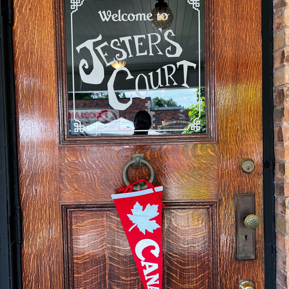 Jester's Court Pub & Eatery - a red pennant hanging on a door - Pubs Near Me - Port Perry, Ontario Jester's Court Pub & Eatery - a red pennant hanging on a door - Pubs Near Me - Port Perry, Ontario