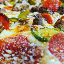 Dolly's Pizza - Pepperoni, Parmesan Reggiano, Italian Sausage and Jalapeno Pizza.