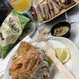Delicious Club and chicken salad sandwiches, with a tasty mimosa.
