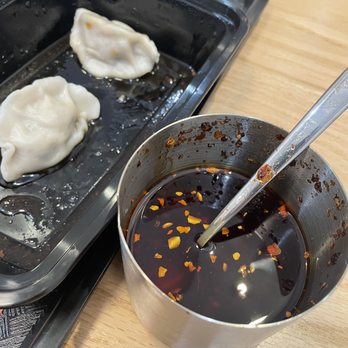 Super Taste - 101. Steamed Pork and Chive Dumplings and chili oil (yum) - Chinese Near Me - New York, New York Super Taste - 101. Steamed Pork and Chive Dumplings and chili oil (yum) - Chinese Near Me - New York, New York
