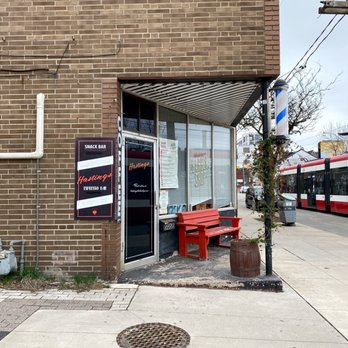 Hastings Snack Bar - a red bench in front of a brick building - Polish Near Me - Toronto, Ontario Hastings Snack Bar - a red bench in front of a brick building - Polish Near Me - Toronto, Ontario
