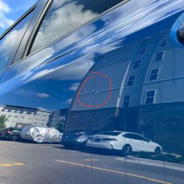 Driver-Side Rear Door Dent (Occurred in care of business)