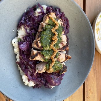 The Exchange - Grilled a pork chop, sautéed purple cabbage, jalapeño grits - Salad Near Me - Asheville, North Carolina The Exchange - Grilled a pork chop, sautéed purple cabbage, jalapeño grits - Salad Near Me - Asheville, North Carolina